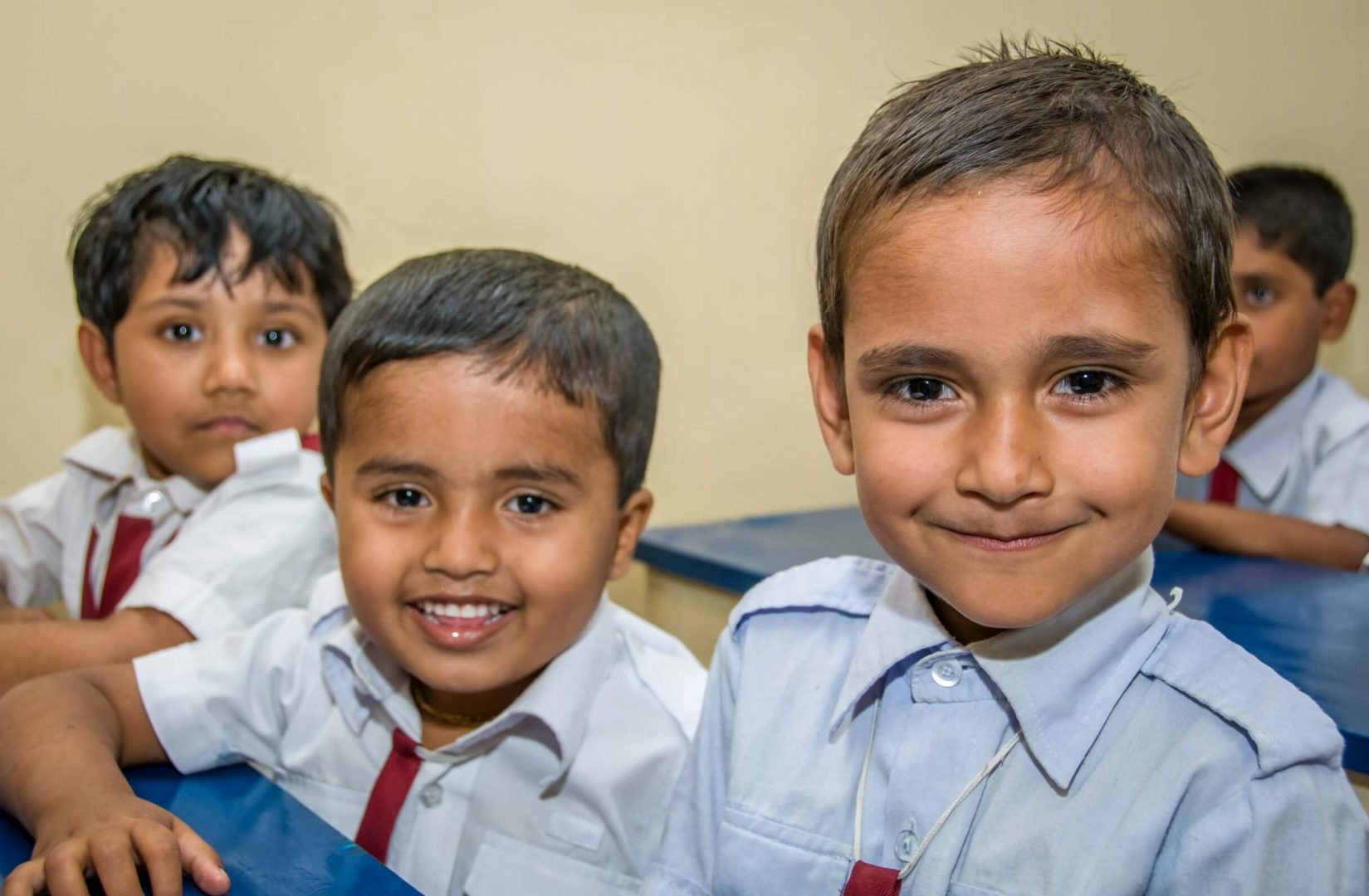 Rozverné tváře malých bangladéšských školáků.